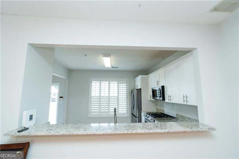Kitchen breakfast bar and open living area